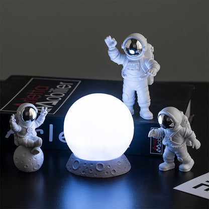 Astronautas e a lua para decoração